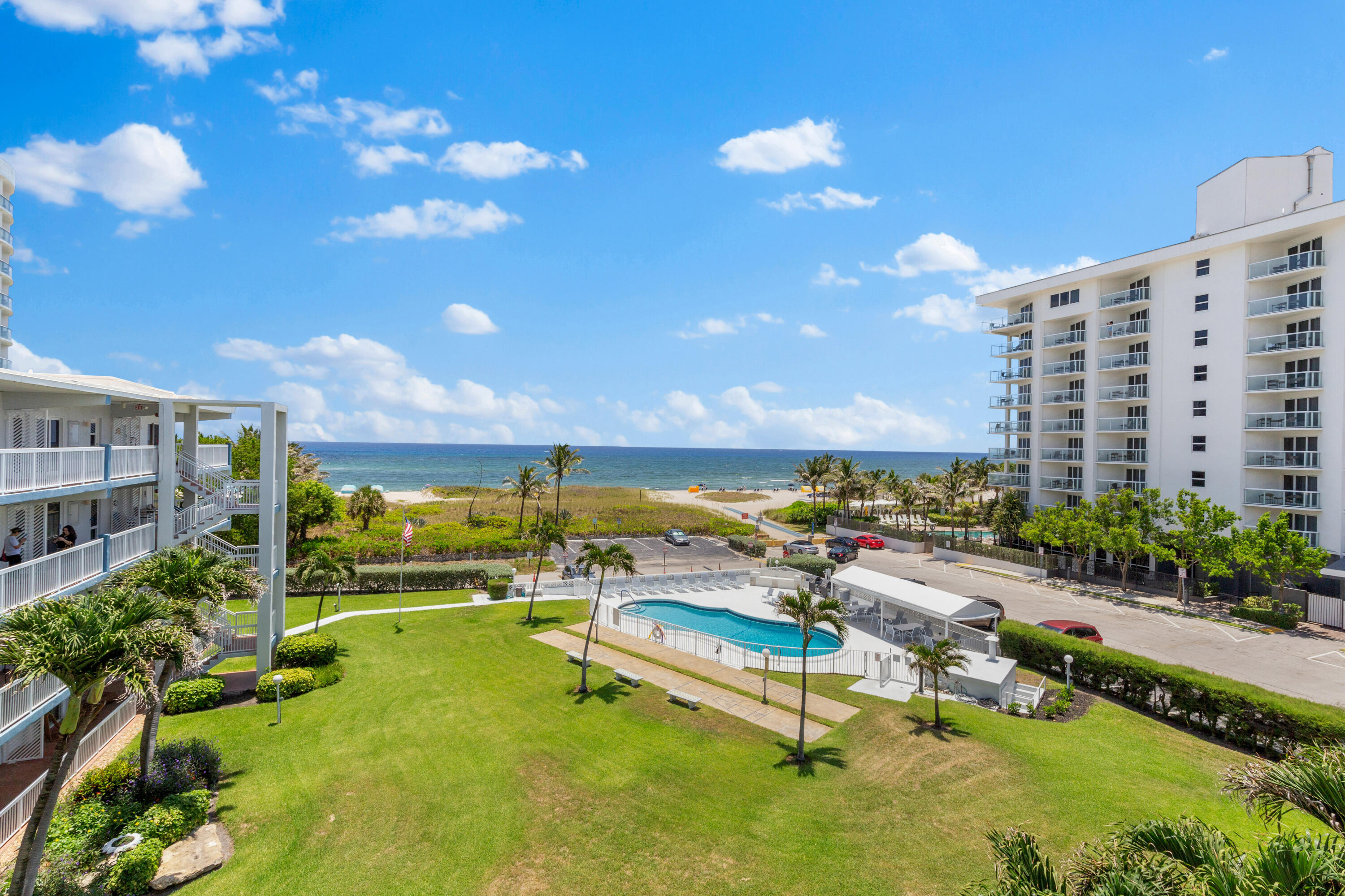 a view of swimming pool with outdoor seating and a patio