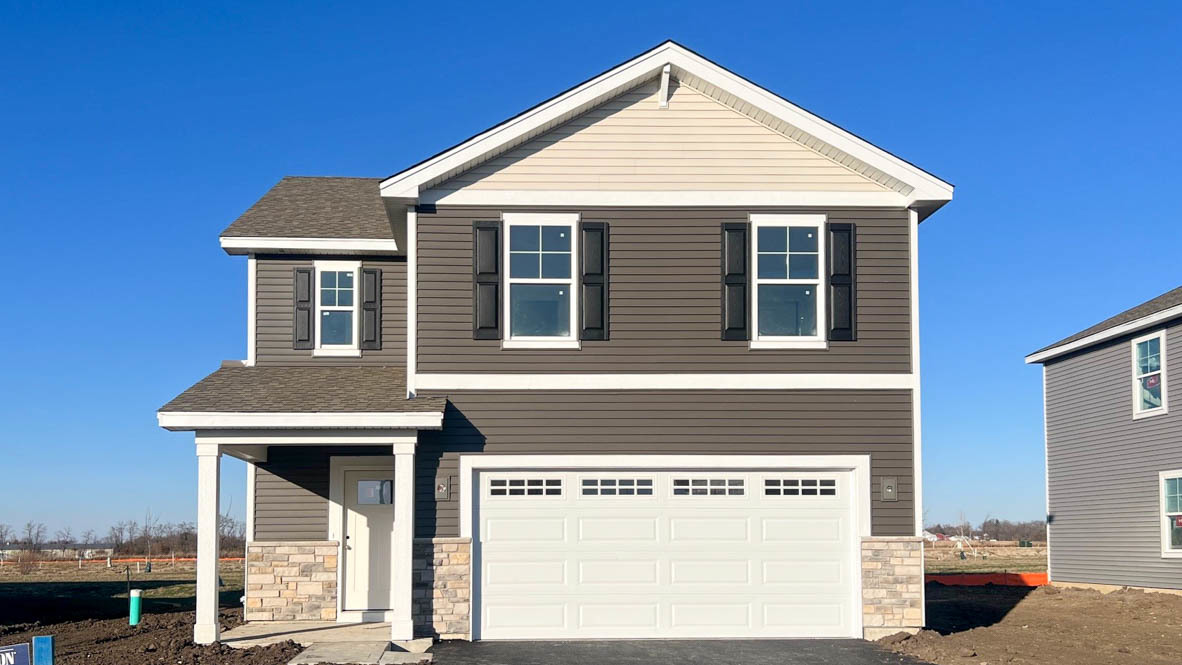 a front view of a house with a garage