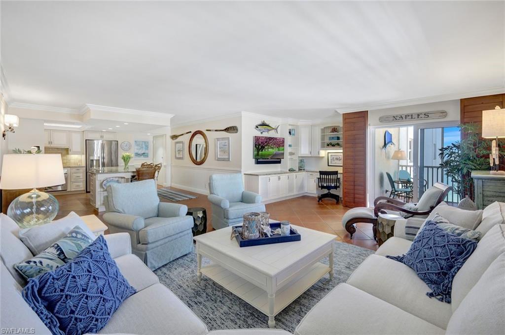 a living room with furniture and a table