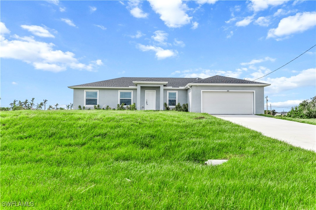 a view of outdoor space yard and front view of house