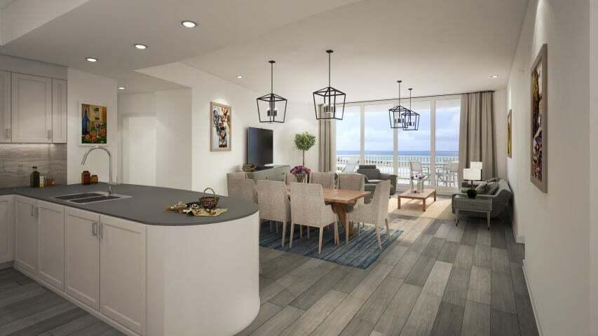 a kitchen with stainless steel appliances granite countertop a stove and a wooden floors