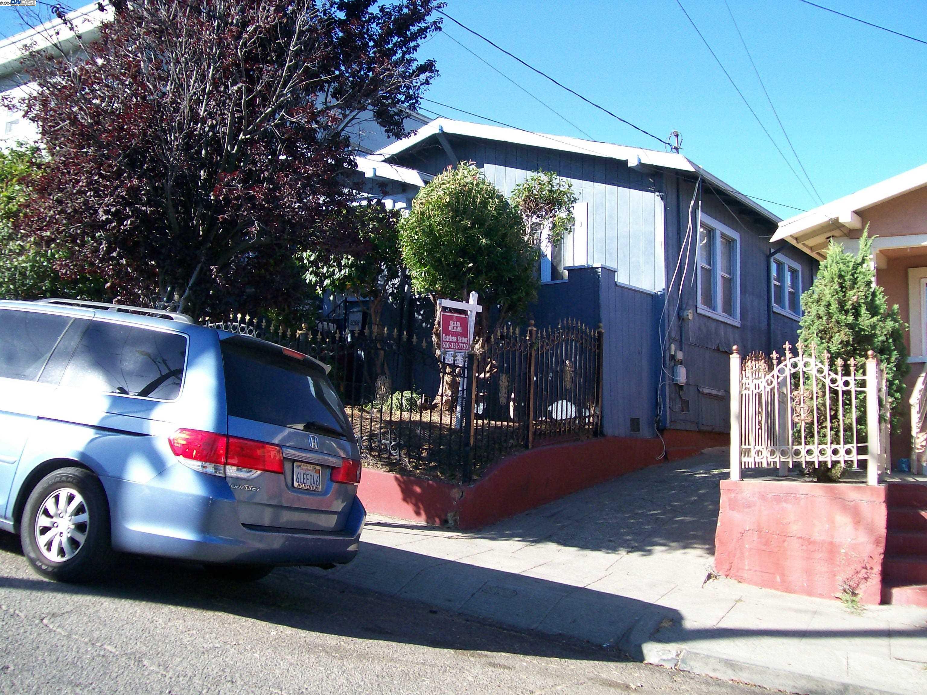 a car parked in front of a house