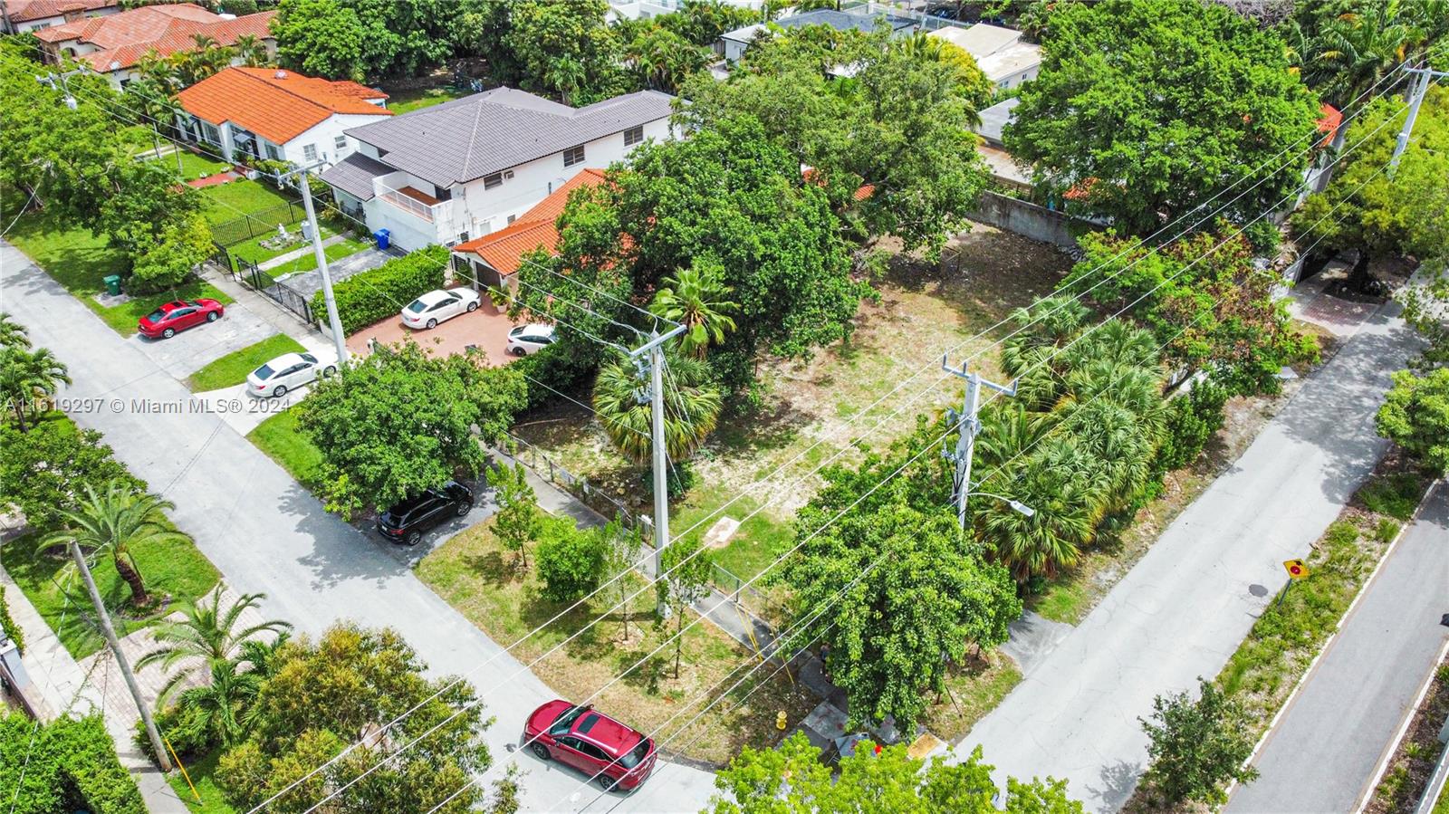 an aerial view of residential house with outdoor space and trees around