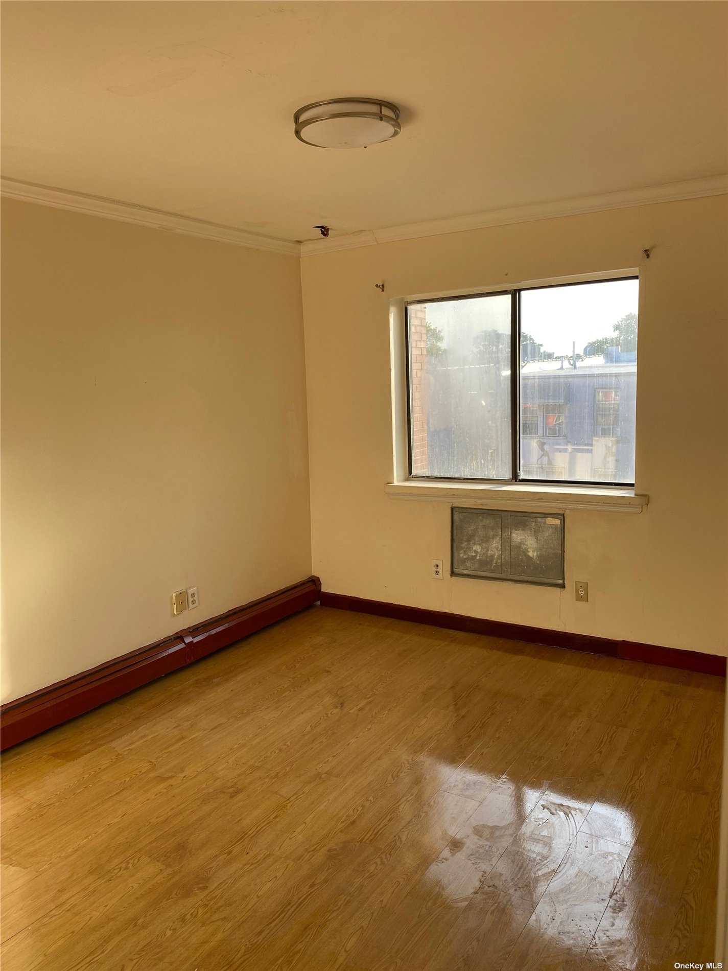 a view of an empty room with a window