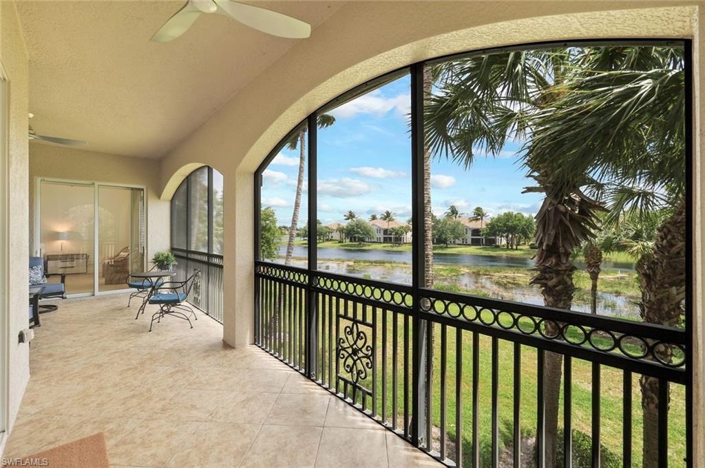 a view of a balcony with couch and wooden floor