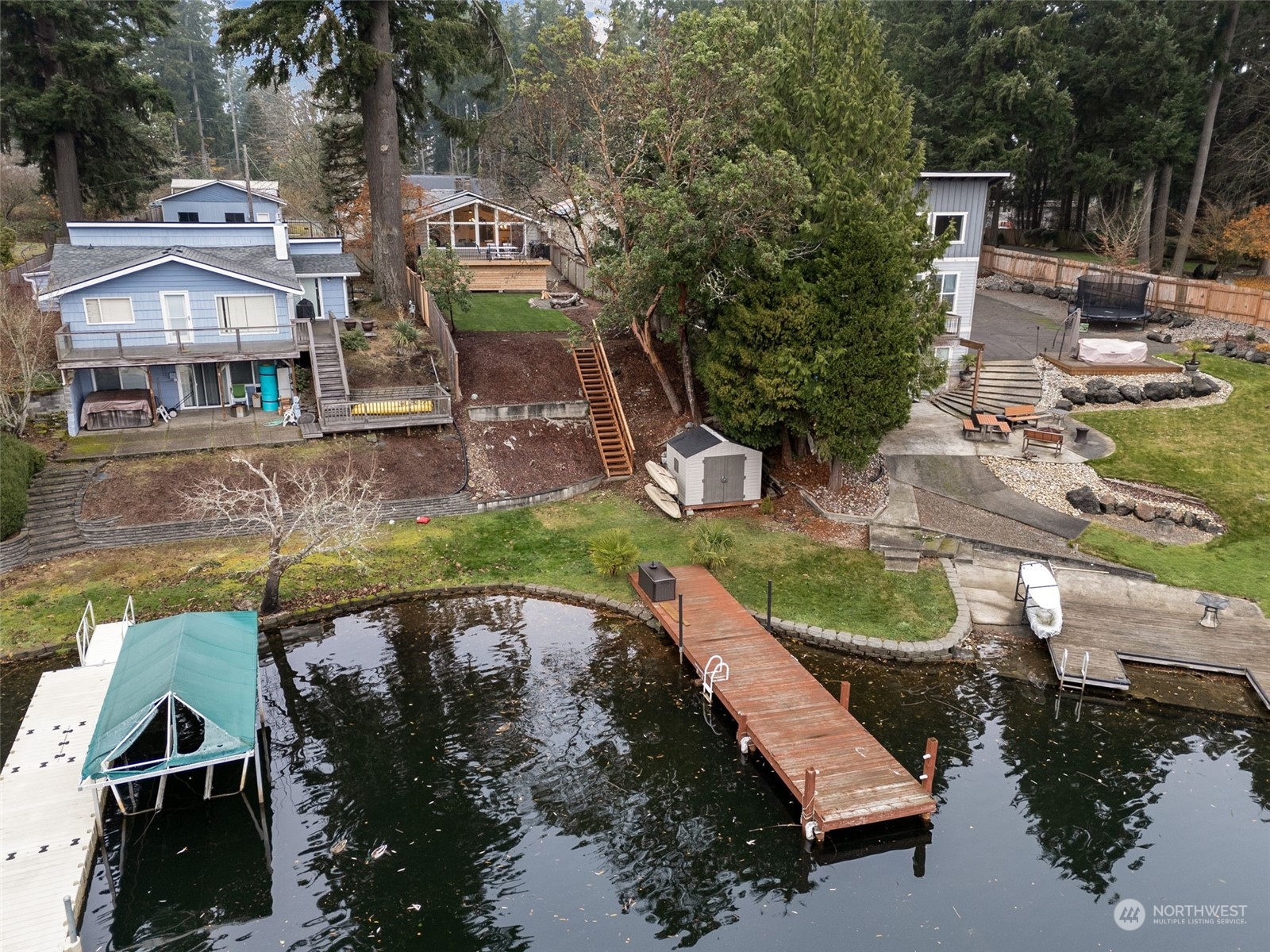 an aerial view of a house with swimming pool