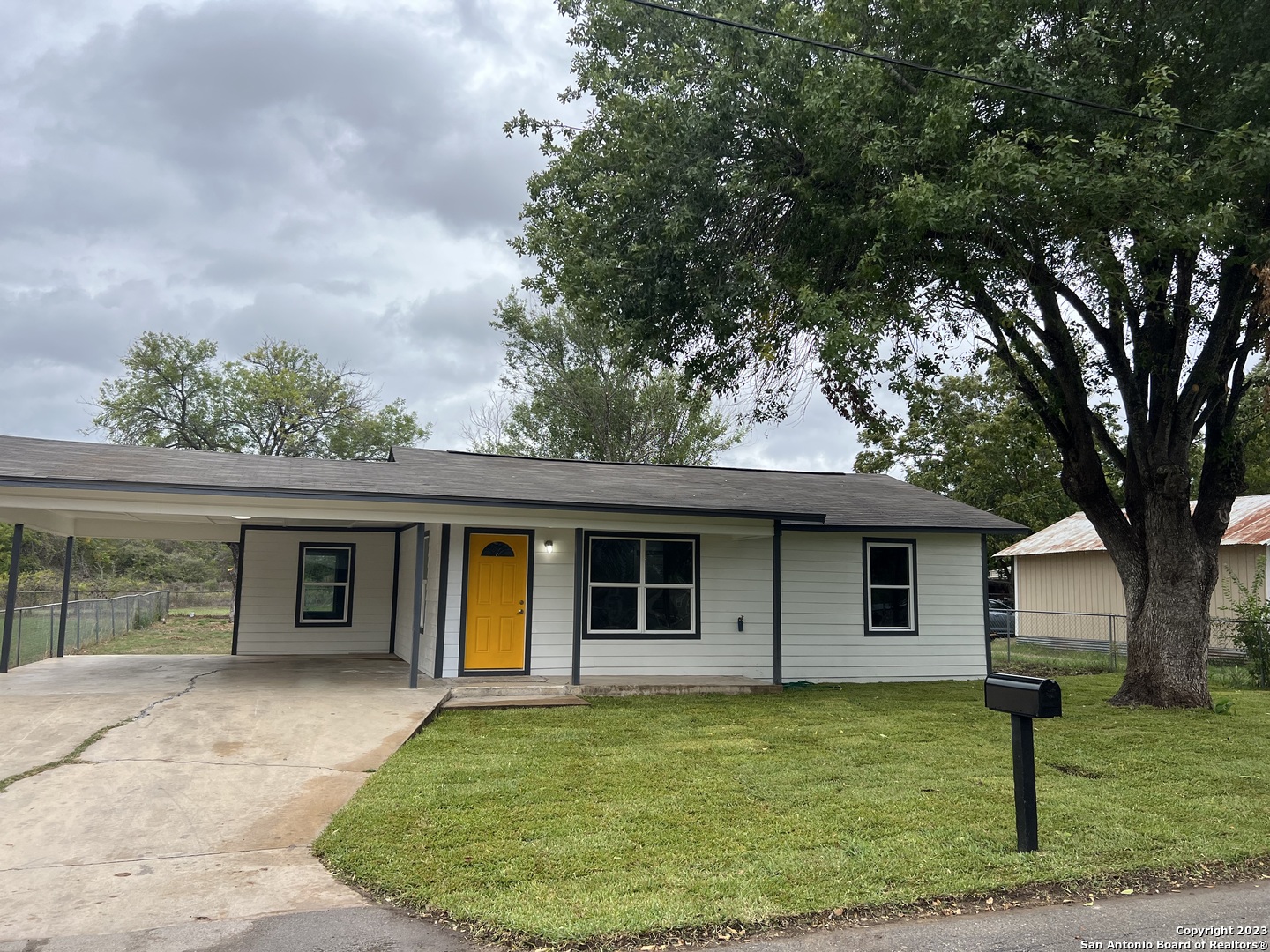 front view of a house with a yard