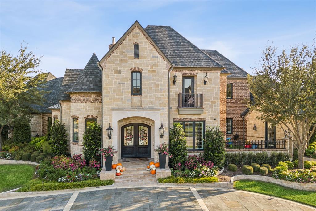 a front view of a house with that has plants