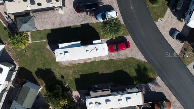 an aerial view of house with yard