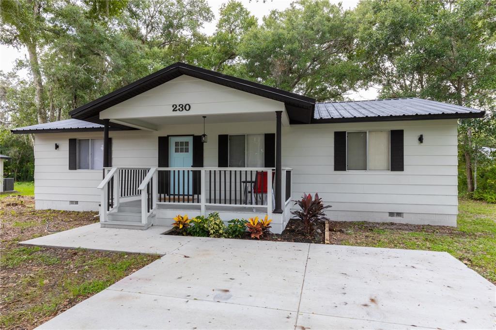 a front view of a house with yard