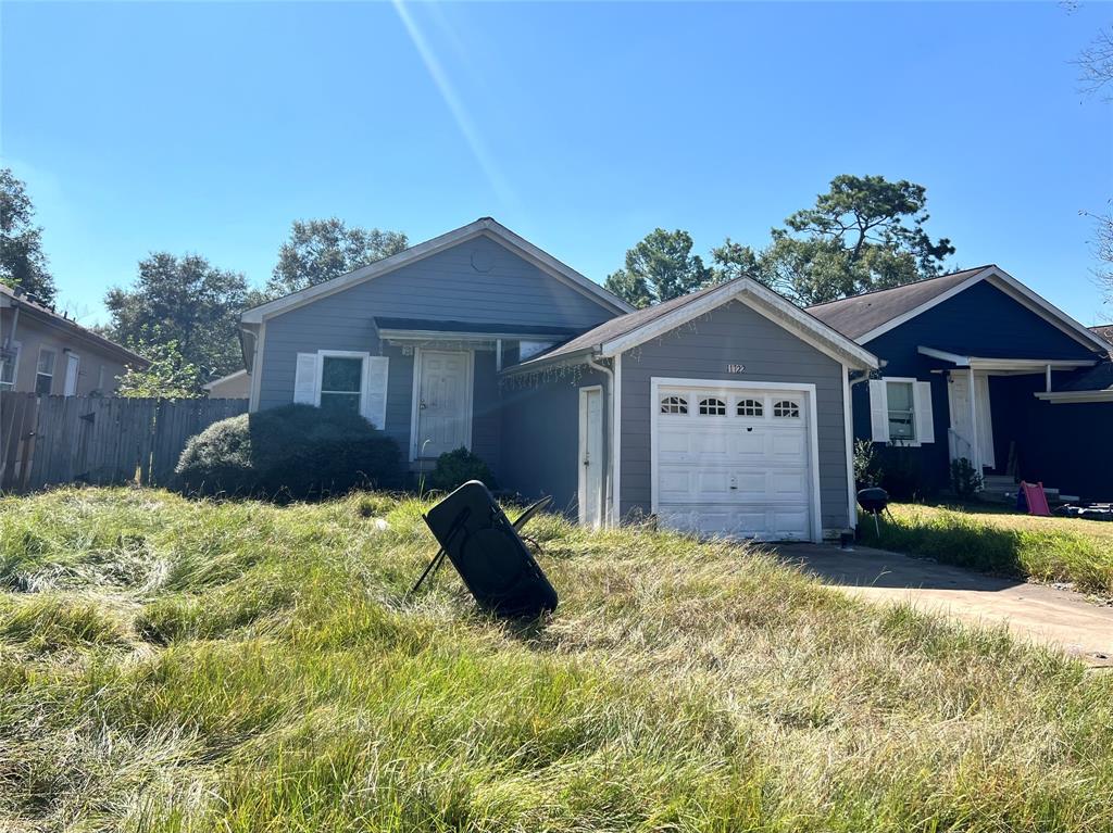 a view of a house with a yard and plants