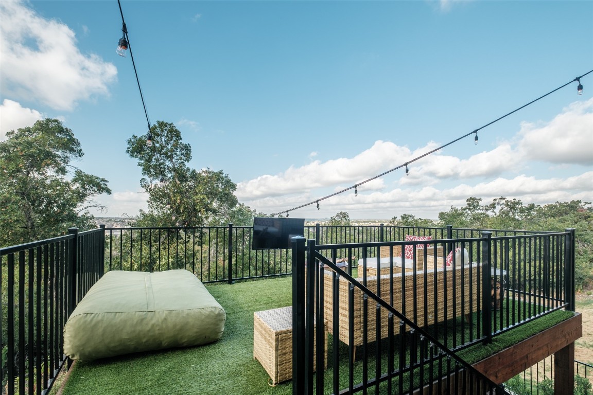 a view of a balcony and yard