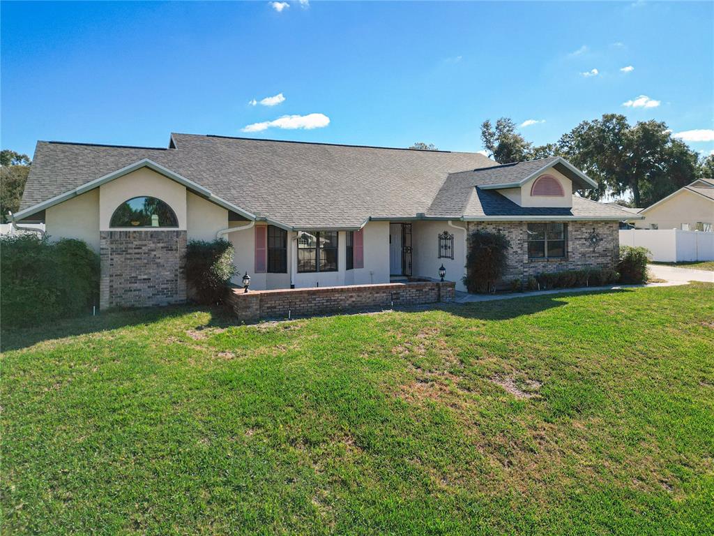 front view of a house with a yard