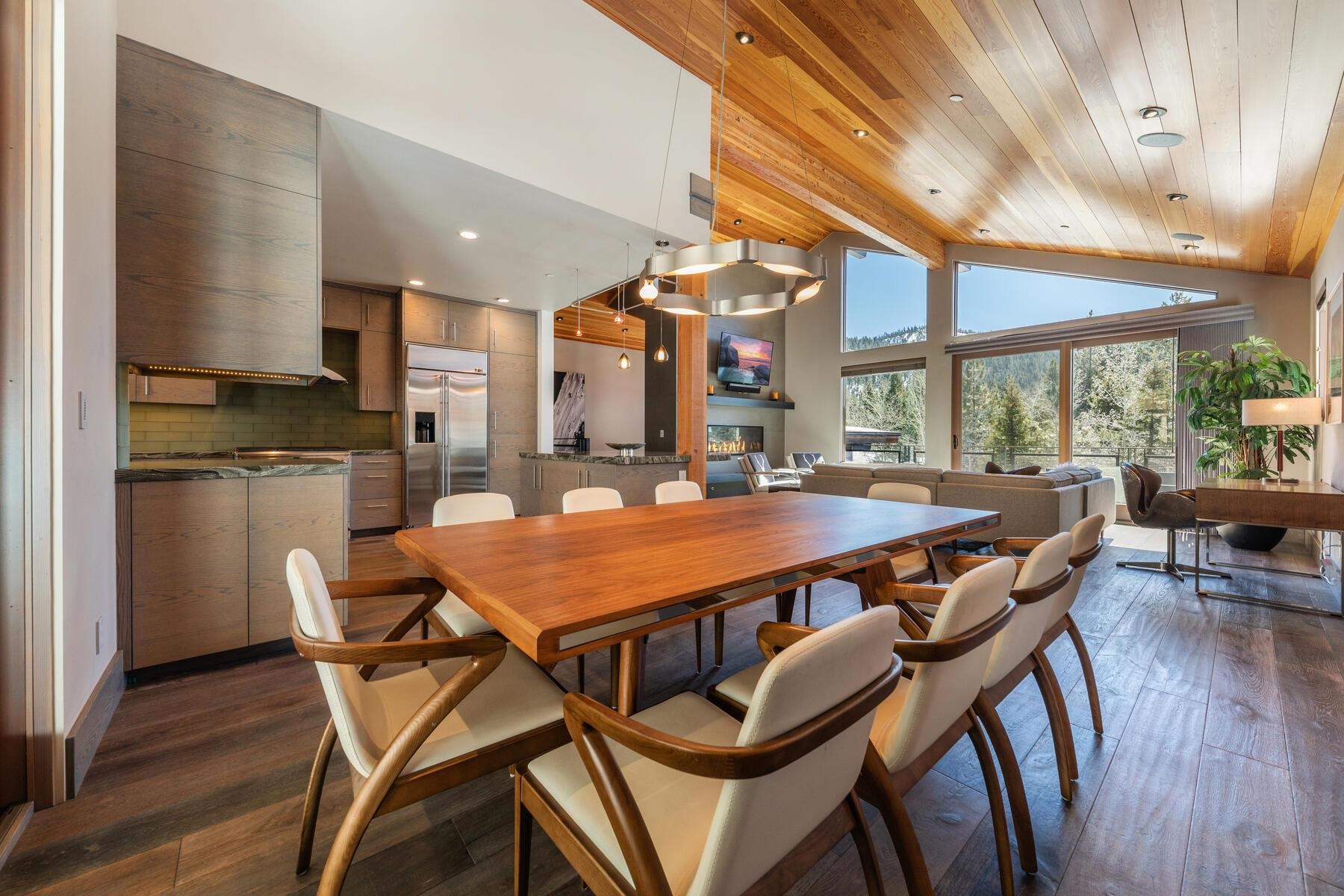 a dining table with chairs and wooden floor