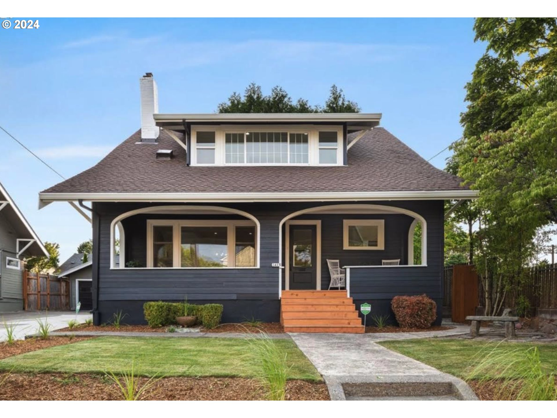 a front view of a house with yard