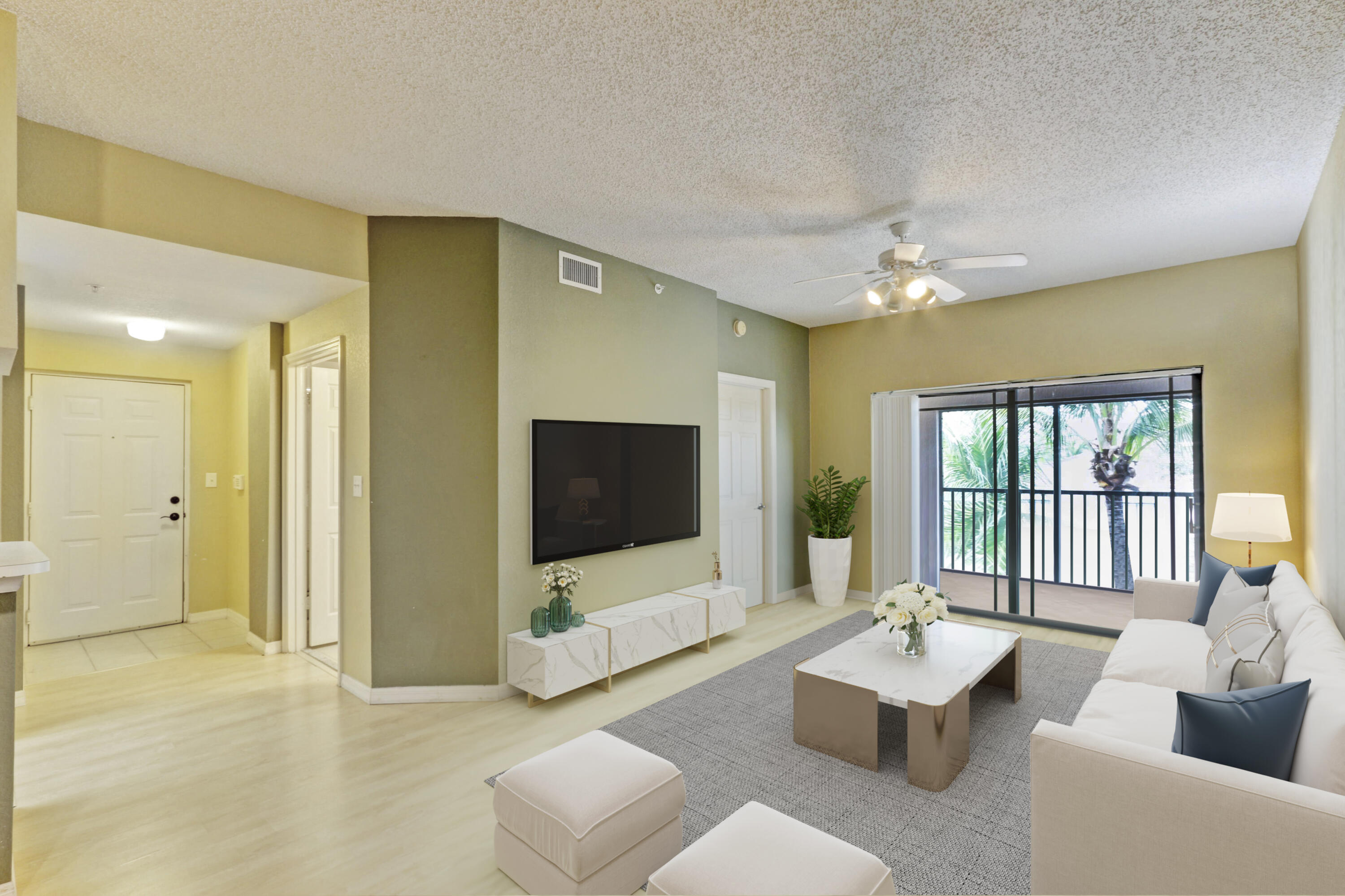 a living room with furniture and a flat screen tv