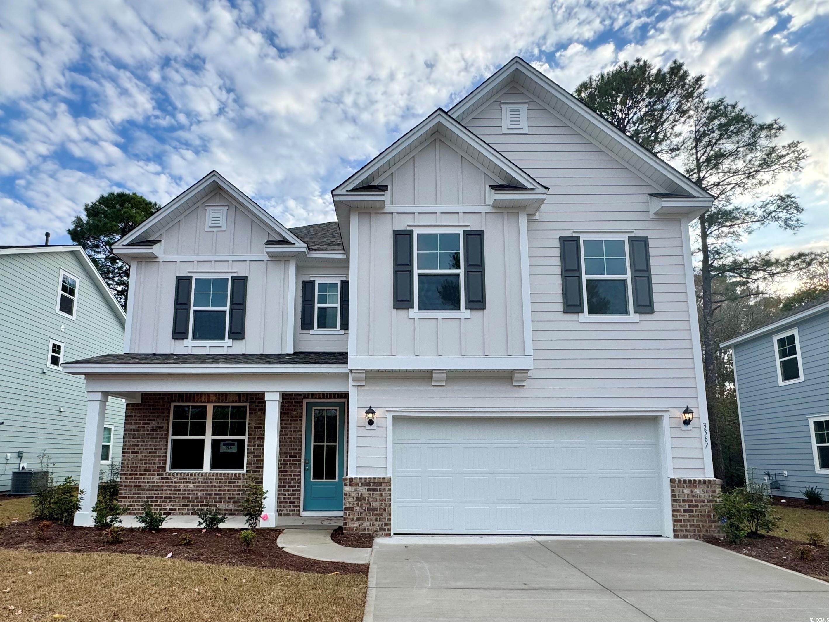 Craftsman inspired home featuring board and batten