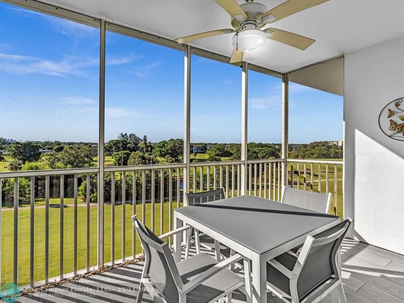 a view of a balcony with furniture