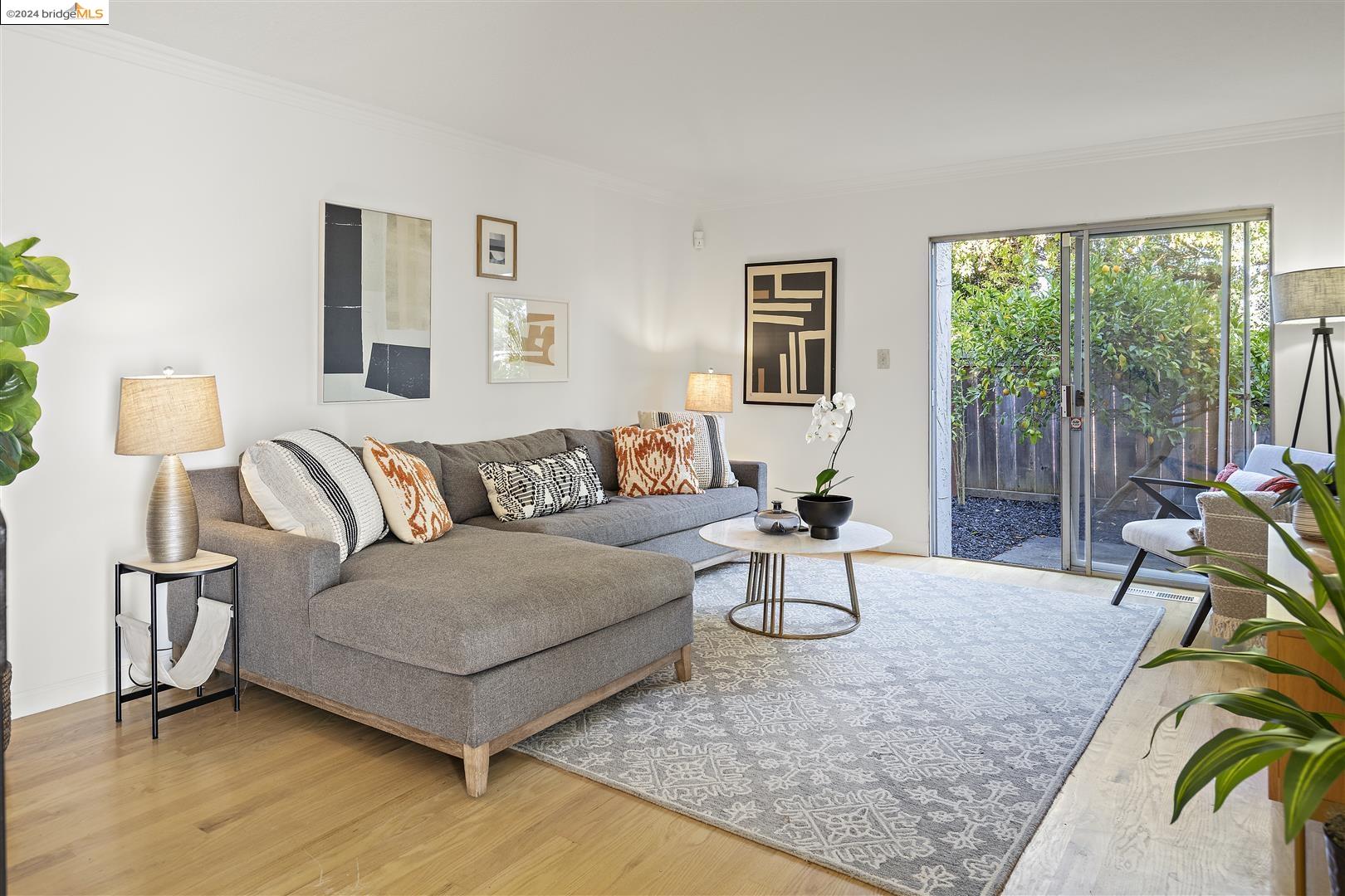 a living room with furniture and a lamp