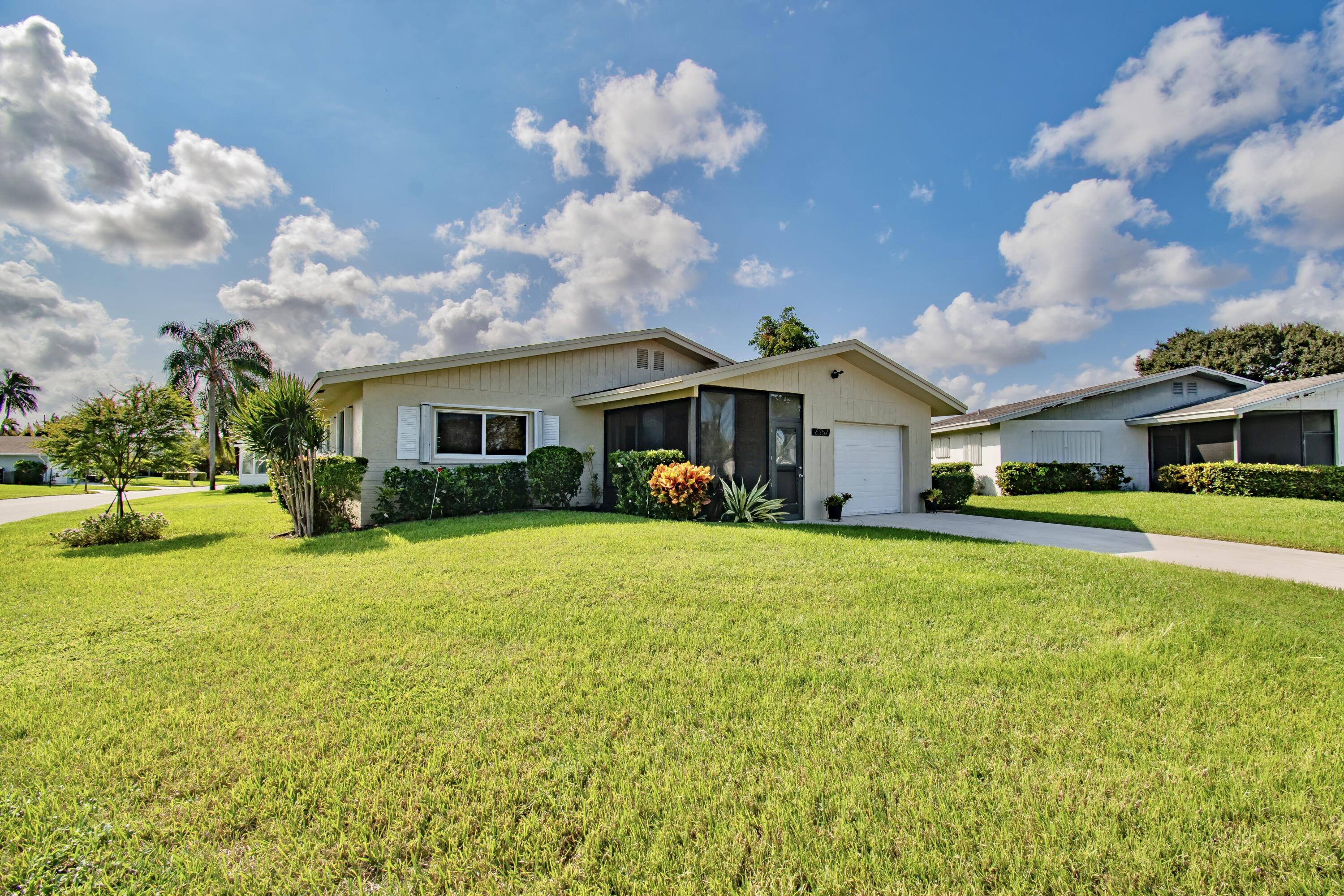 a front view of house with an outdoor space and seating