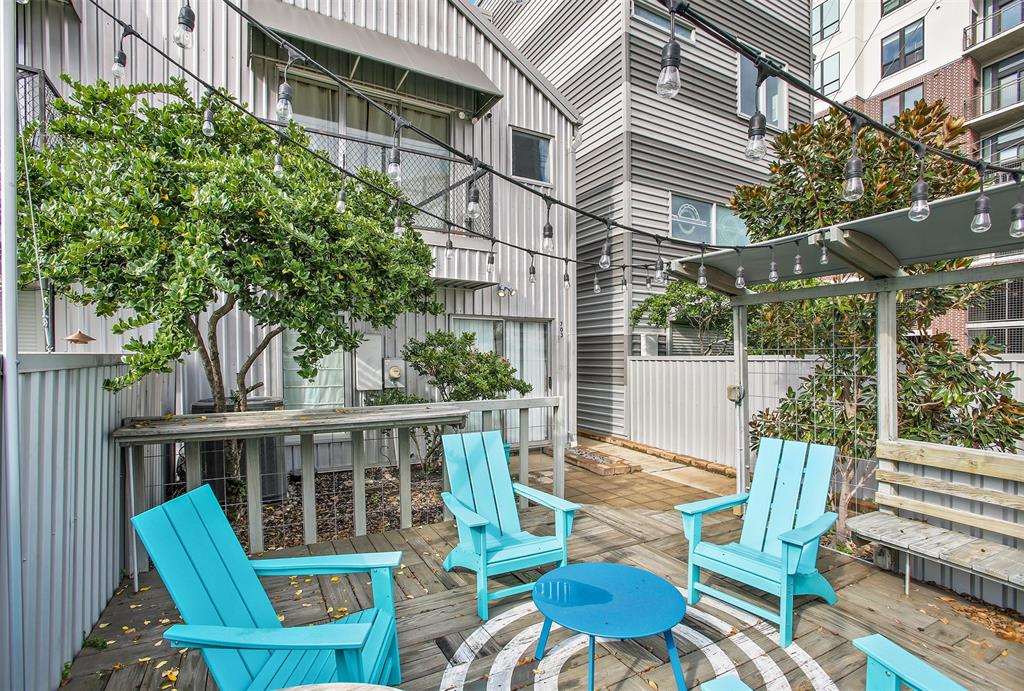 a view of a chair and tables in the patio