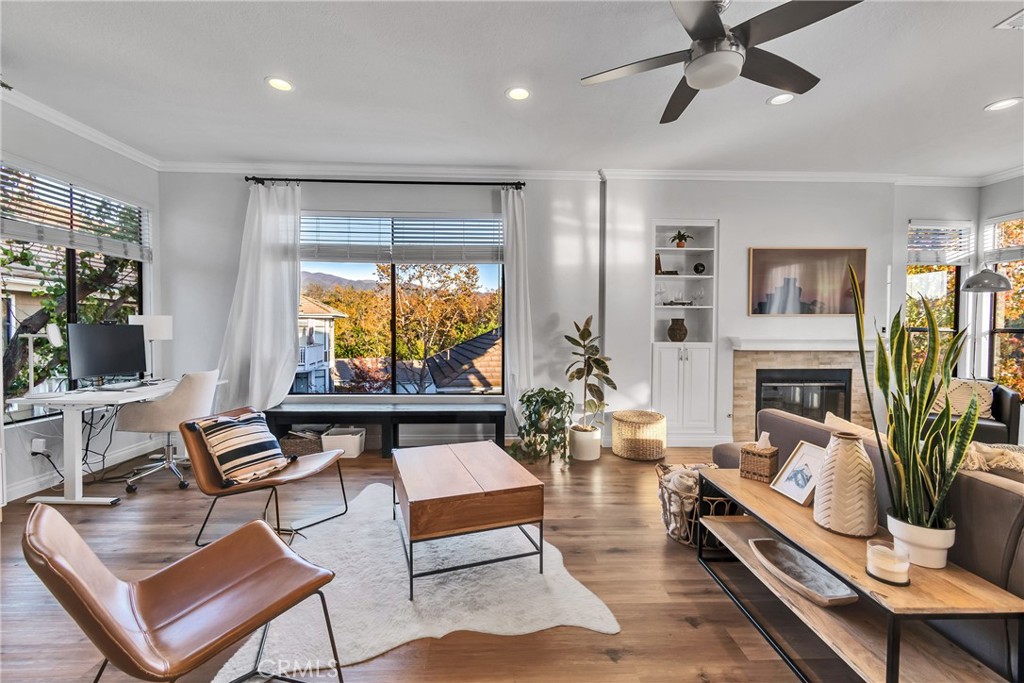 a living room with fireplace furniture and a flat screen tv