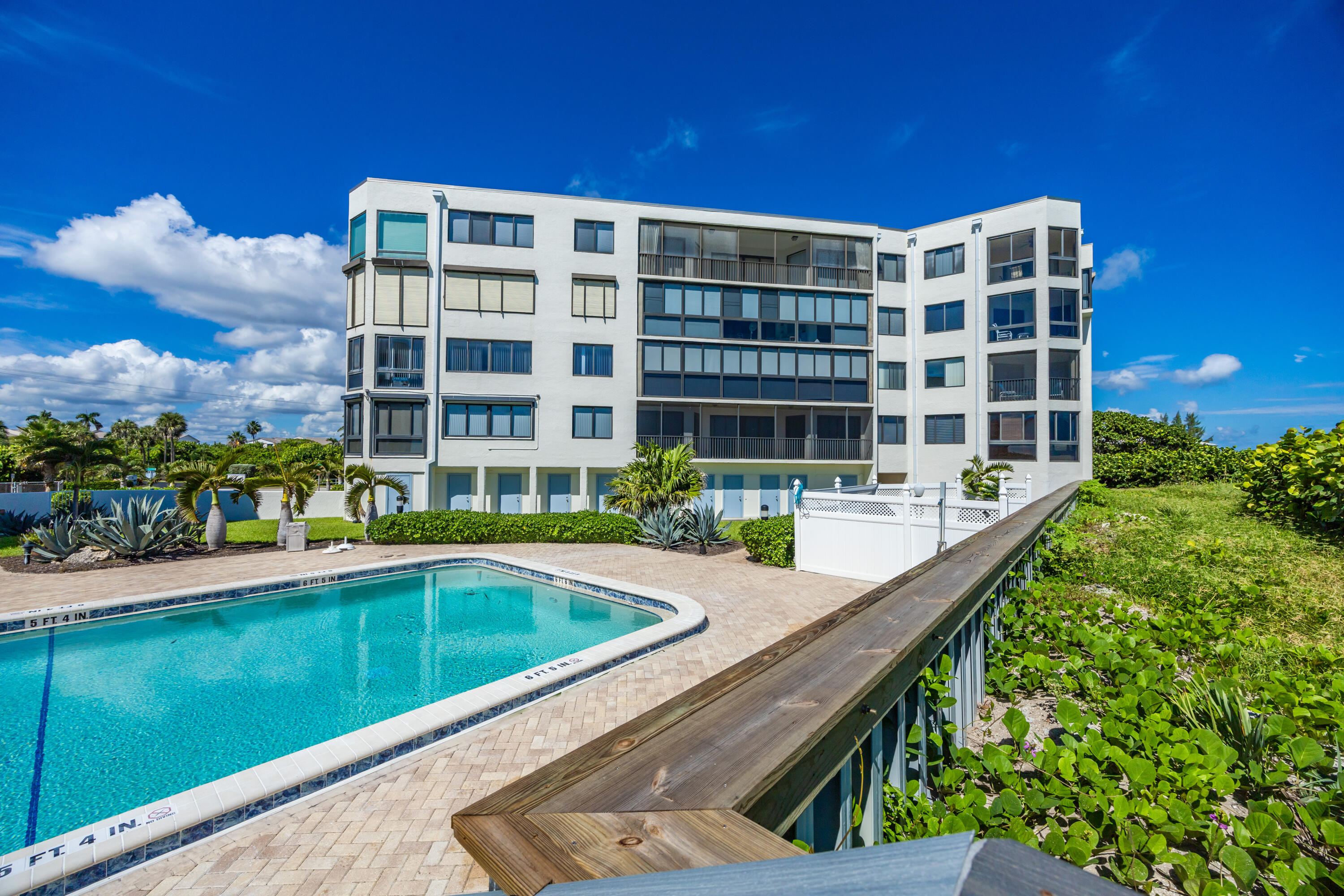 a front view of a house with a swimming pool