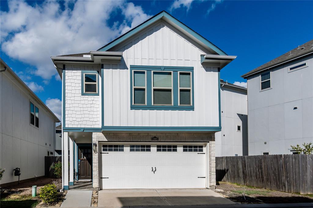 a front view of a house with a garage