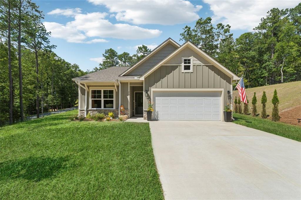 a front view of house with yard and green space