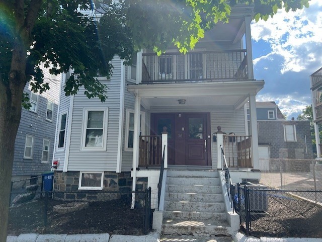 a view of a house with a tree front of house