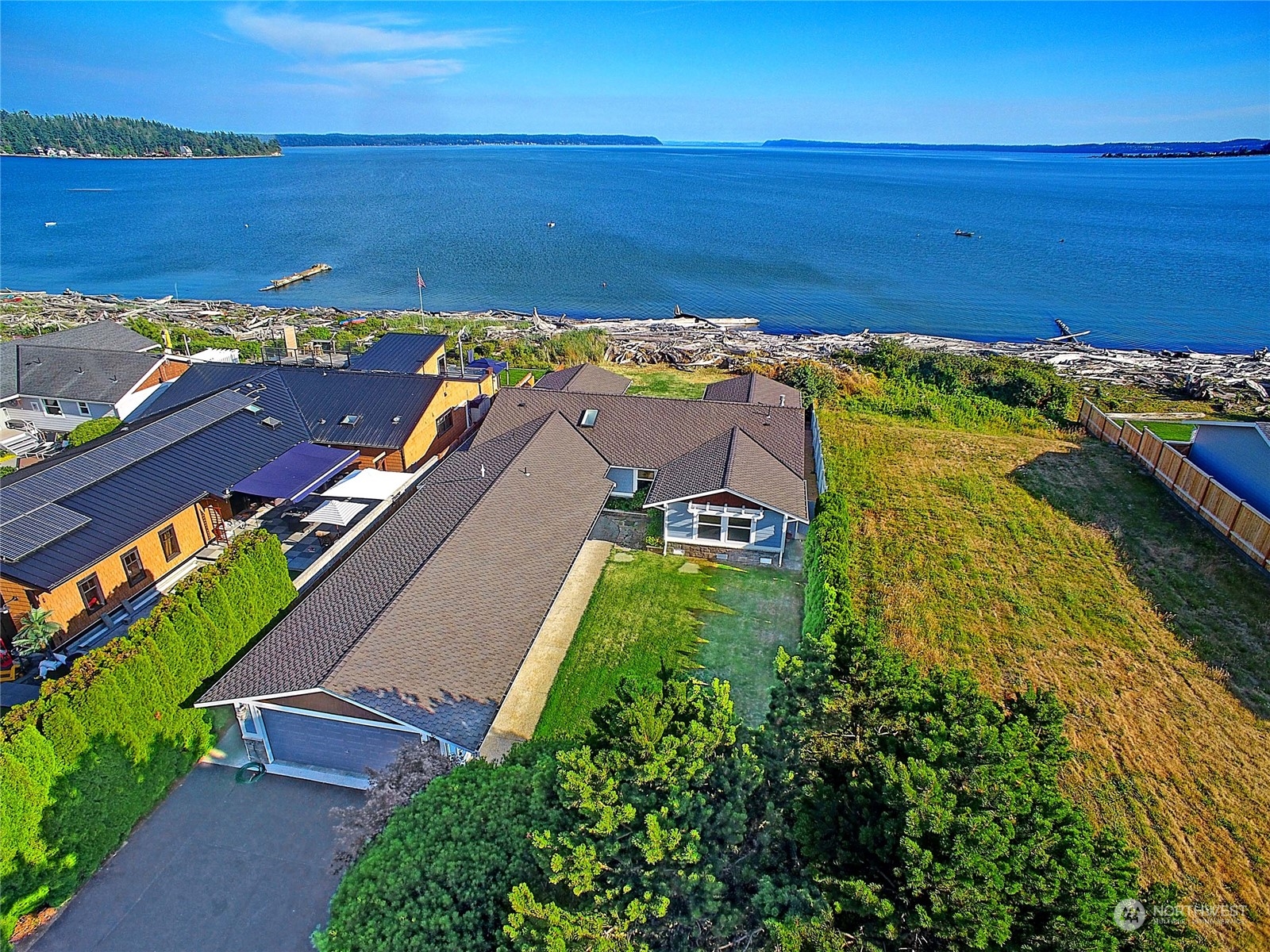 an aerial view of a house with a lake view