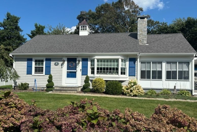 a front view of a house with a yard