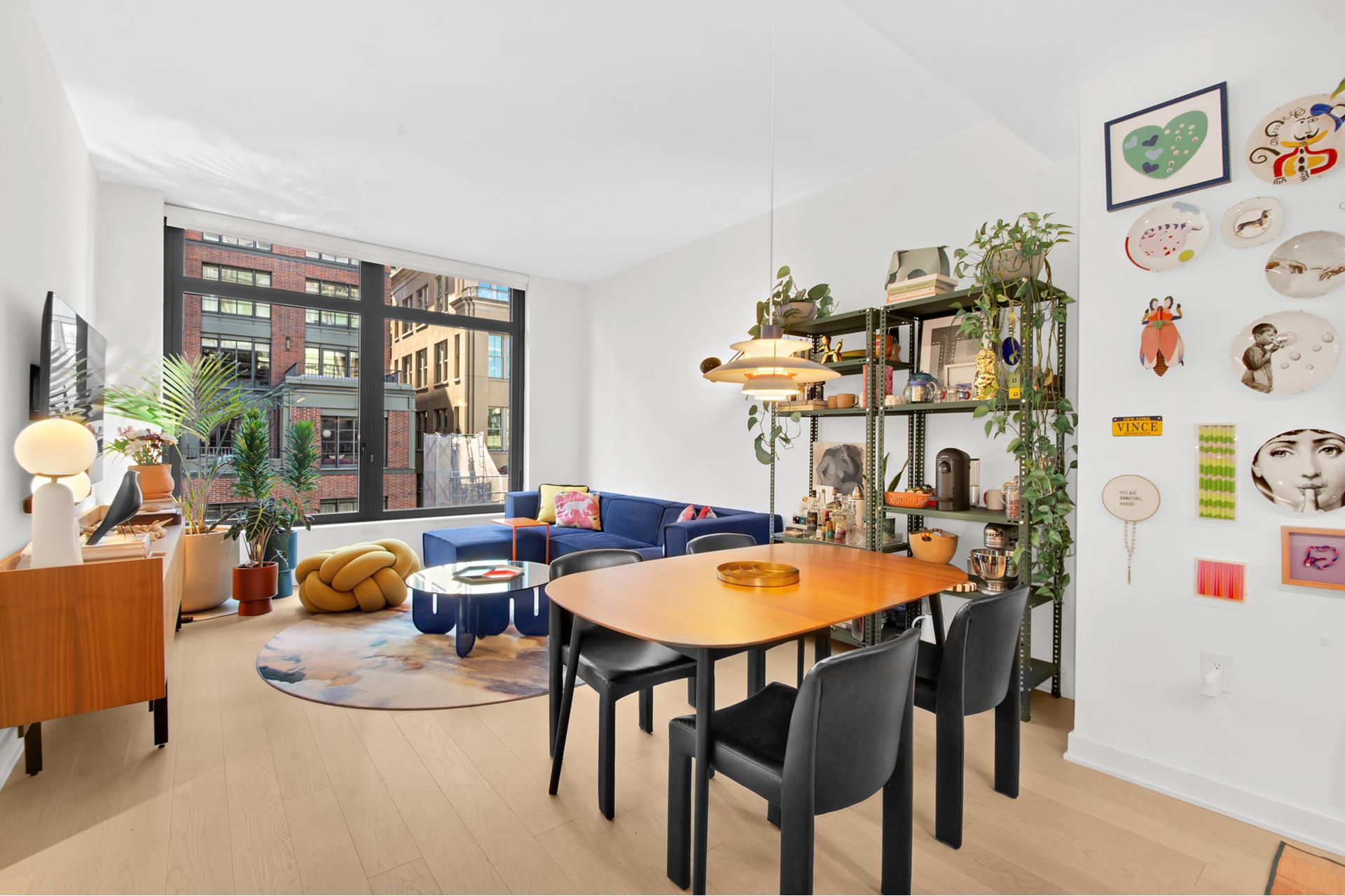 a view of a dining room with furniture and window