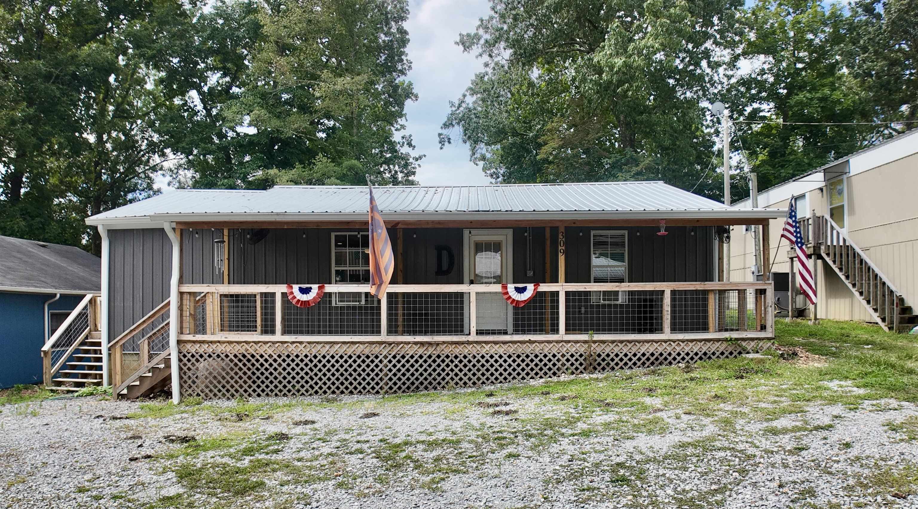 front view of a house with a fence