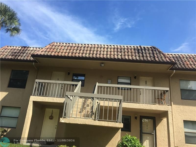 front view of a house with a balcony