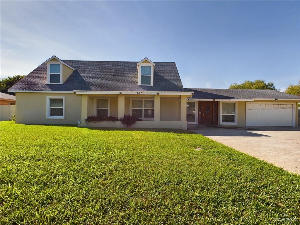 front view of a house with a garden