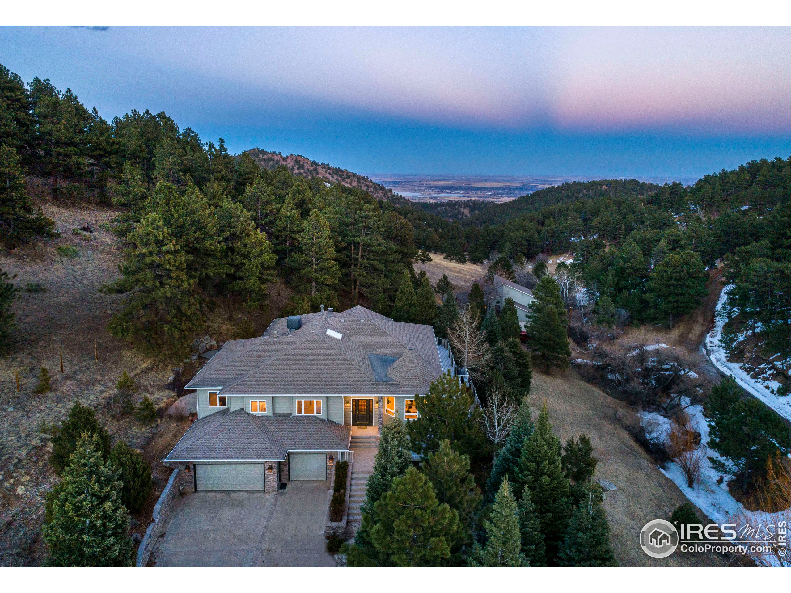 an aerial view of a house with mountain view