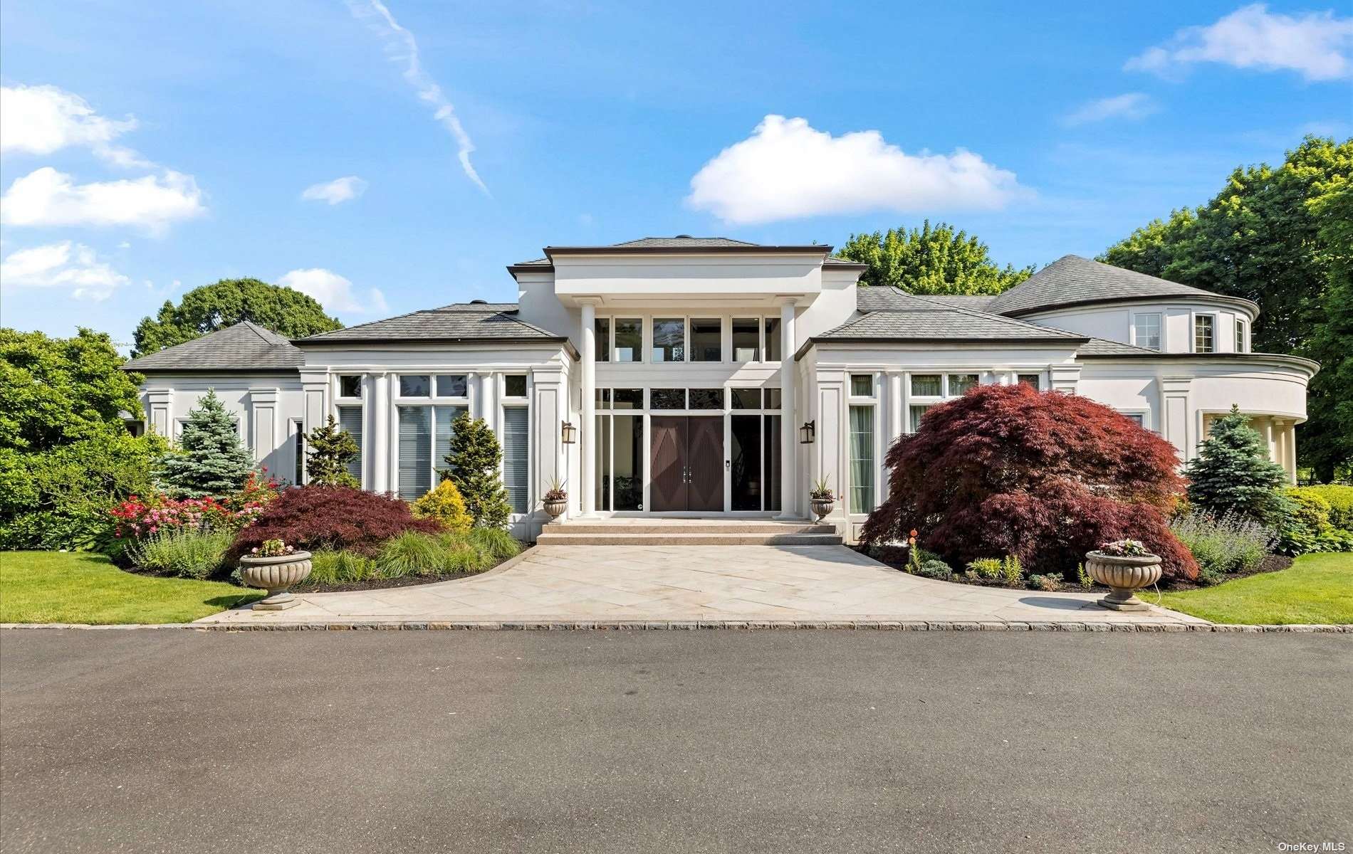 front view of a house with a garden