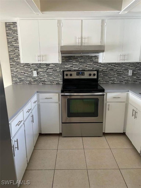 a kitchen with cabinets and appliances