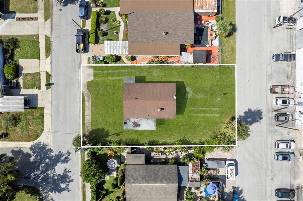 an aerial view of a house with a swimming pool