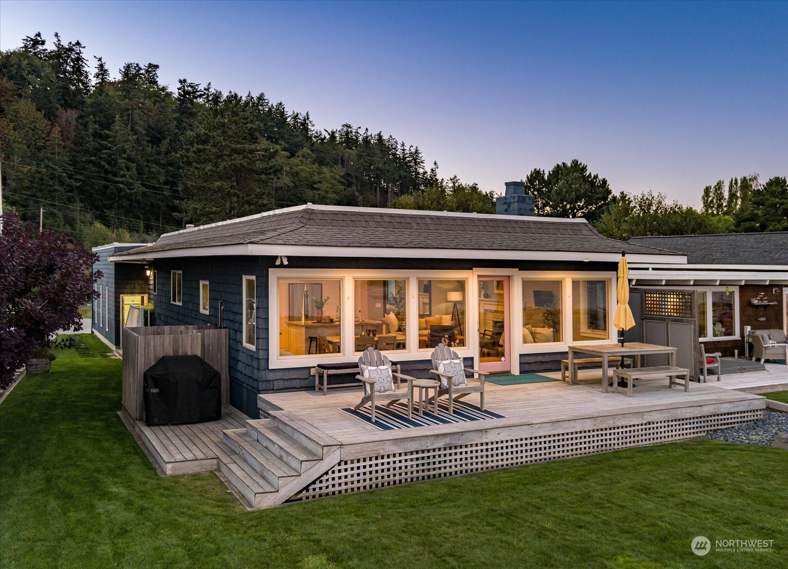 a view of house with swimming pool and porch