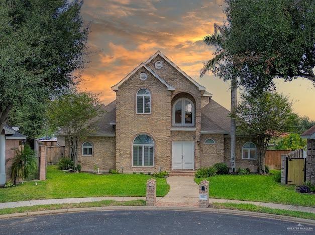 a view of a yard in front view of a house