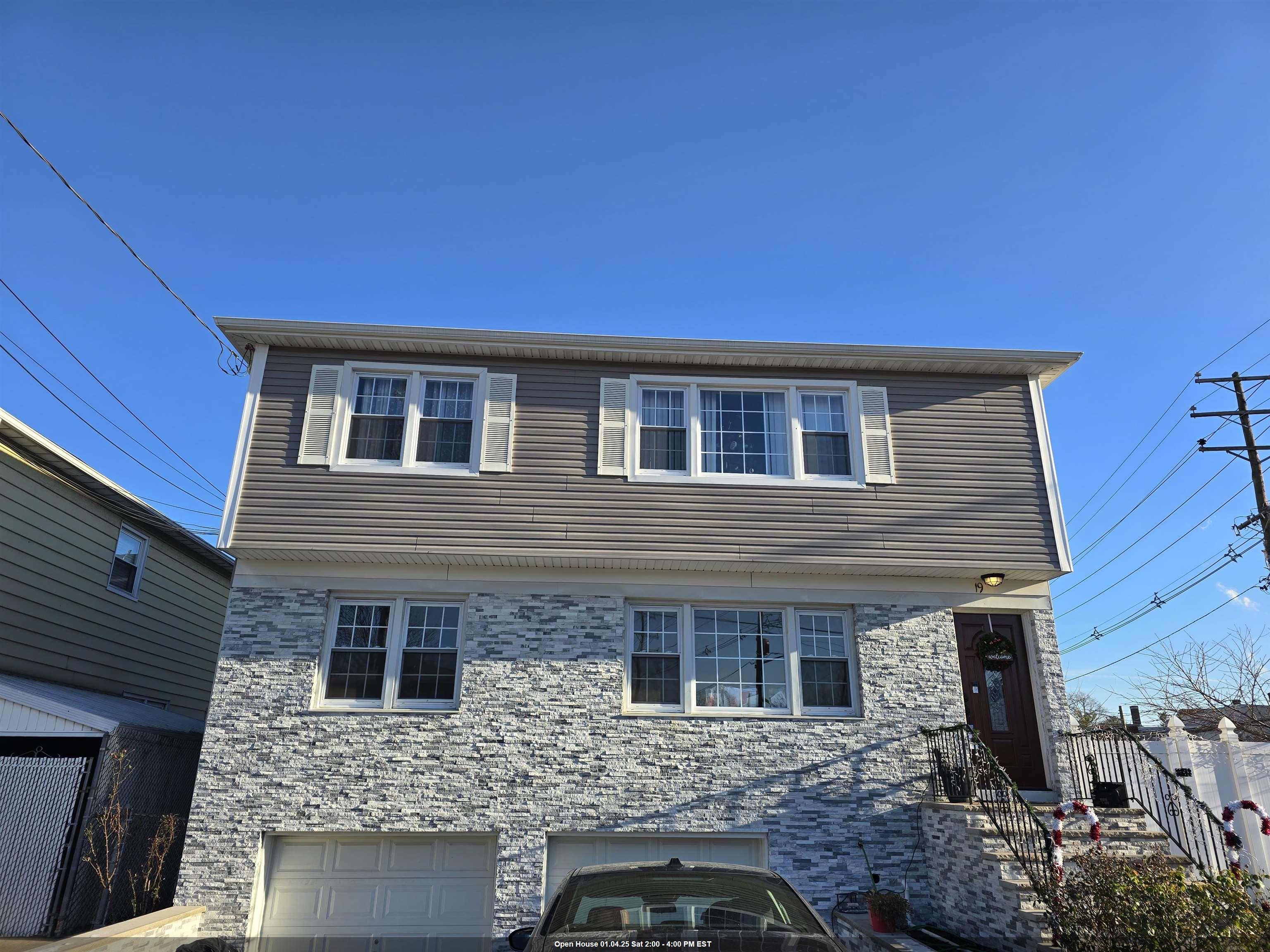 a front view of a house with parking space