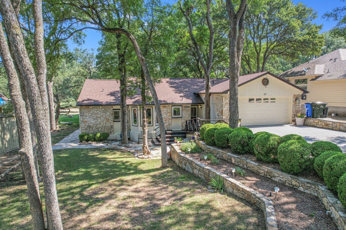 a backyard of a house with yard and outdoor seating