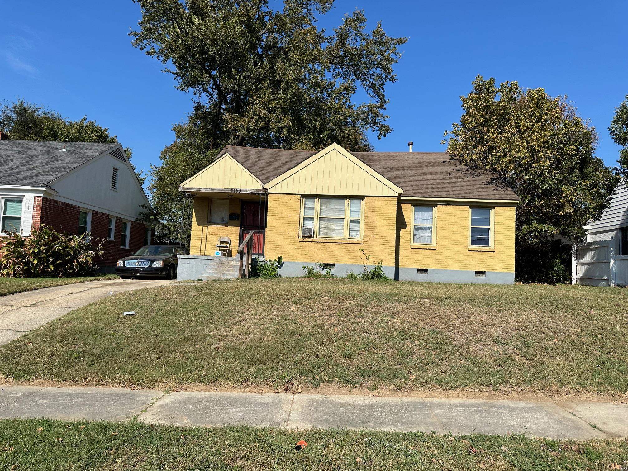 Bungalow-style house with a front lawn