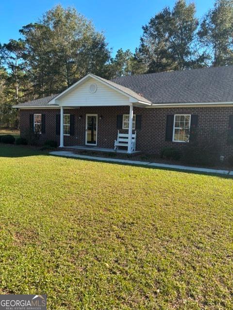 a front view of a house with yard