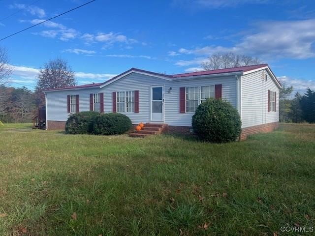 View of front of property with a front yard