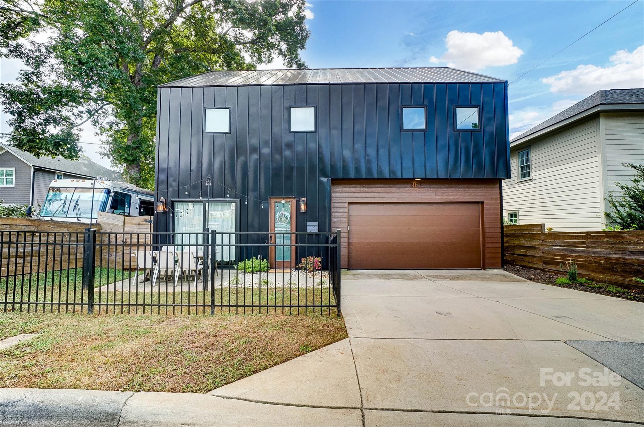 a view of a house with a fence