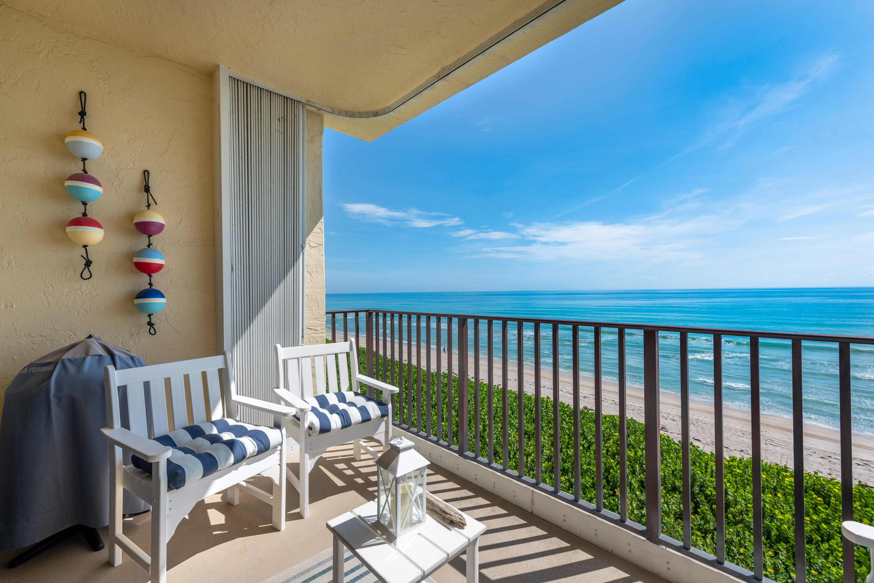 a view of balcony with furniture