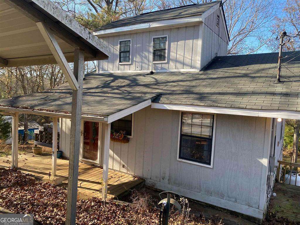 a front view of a house with parking area